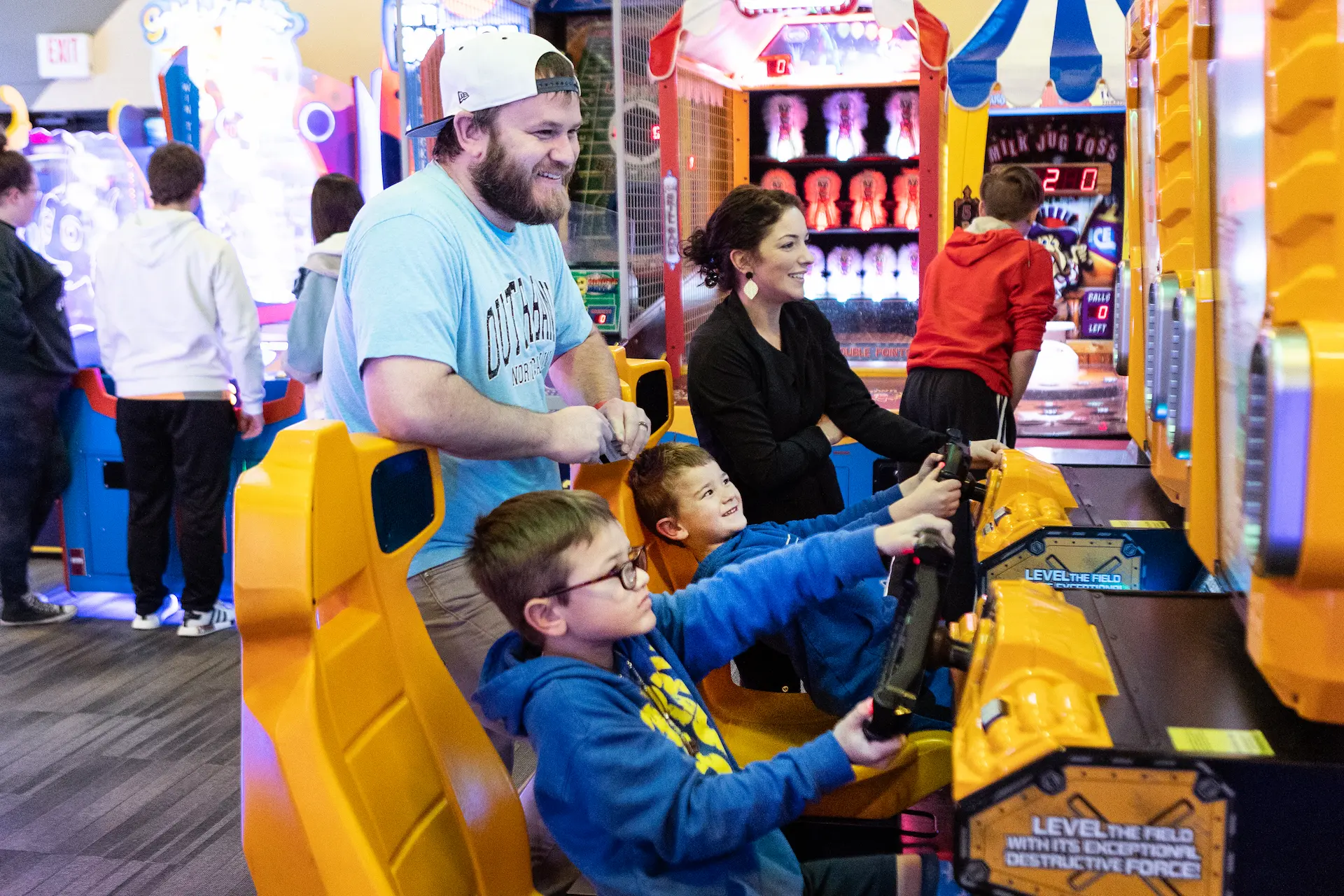 child playing with his father in a racing game