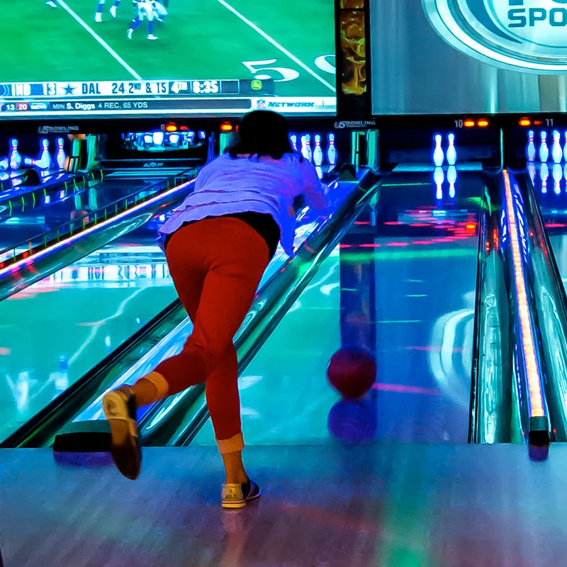 person bowling down an alley