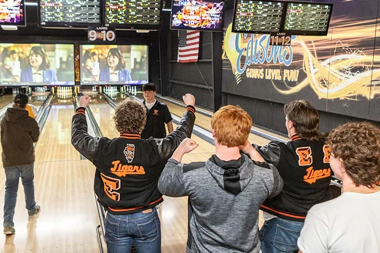 children playing bowling together